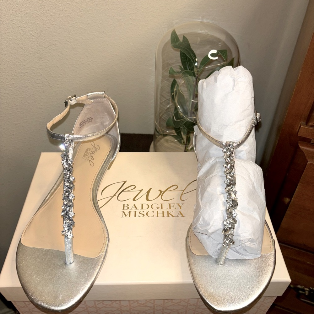 Jewel Badgley Mischka thong sandals; back closure; silver rhinestones;